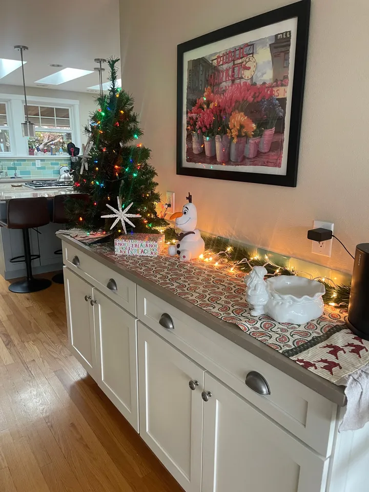 Kitchen side counter and cabinets in a home Rosy cleaned, decorated for the holidays
