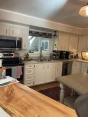 Kitchen with a live-edge counter, cleaned by Rosy