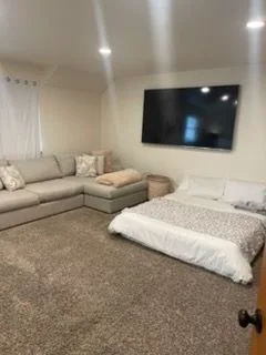 Bonus room with a sectional, cleaned by Rosy