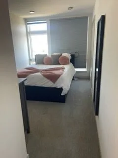Narrow bedroom, freshly made, cleaned by Rosy